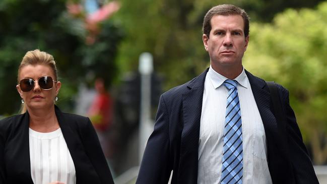 Former Billabong boss Matthew Perrin (centre) and his partner Belinda Otton (left), arriving for his trial at the District Court in Brisbane, in December, 2016.