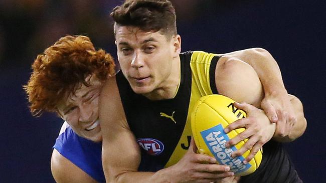 AFL Round 7. 04/05/2019. Western Bulldogs v Richmond at Marvel Stadium.   Richmonds Dion Prestia  tackled by Bulldog Ed Richards  2nd quarter    . Pic: Michael Klein.