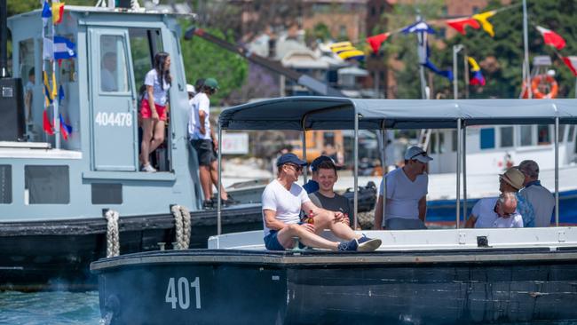 Passengers enjoy the sun on workboats, all of which drove in formation after the sailing. Picture: Thomas Lisson