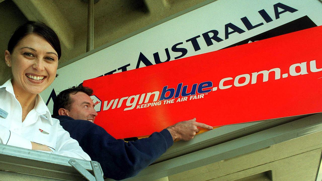 A Virgin Blue sign replacing old Ansett ones at Brisbane Airport in 2001. Rex may have been hoping it could have done the same but replace Virgin,