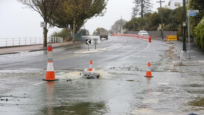 An overflowing sewage drain closed Sandy Bay Road south of Wrest Point.  Picture: MATHEW FARRELL