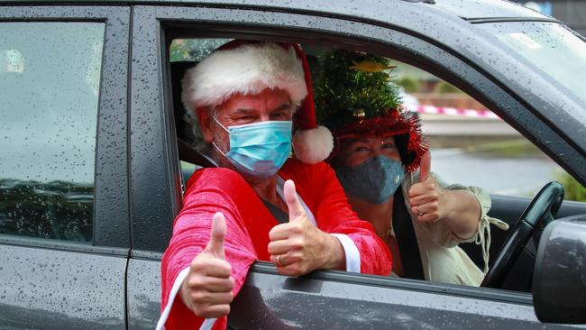 Santa’s helpers Nigel Berridge and Sarah Le-Hanie, from Avalon, getting tested on Christmas Day at the pop-up Avalon COVID 19 testing station. Manly locals have not been able to see loved ones since well before Christmas: Picture: Justin Lloyd.