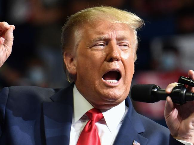 TOPSHOT - US President Donald Trump speaks during a campaign rally at the BOK Center on June 20, 2020 in Tulsa, Oklahoma. - Hundreds of supporters lined up early for Donald Trump's first political rally in months, saying the risk of contracting COVID-19 in a big, packed arena would not keep them from hearing the president's campaign message. (Photo by Nicholas Kamm / AFP)