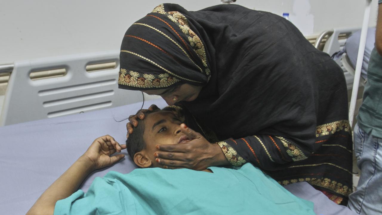 A mother comforts of her child injured in an Indian missile attack, at a hospital in Bahawalpur, Pakistan's Punjab province. Picture: AP Photo