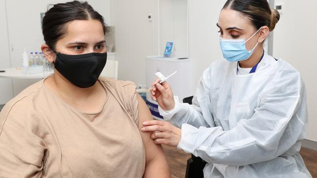 Ms Isaac vaccinating patient Tina Dhillon. Picture: Richard Dobson