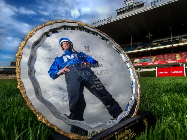 Winx’s jockey Hugh Bowman with the 2017 Cox Plate on the straight in front of the grandstand at Moonee Valley’s Breakfast With the Best. Picture: Jay Town