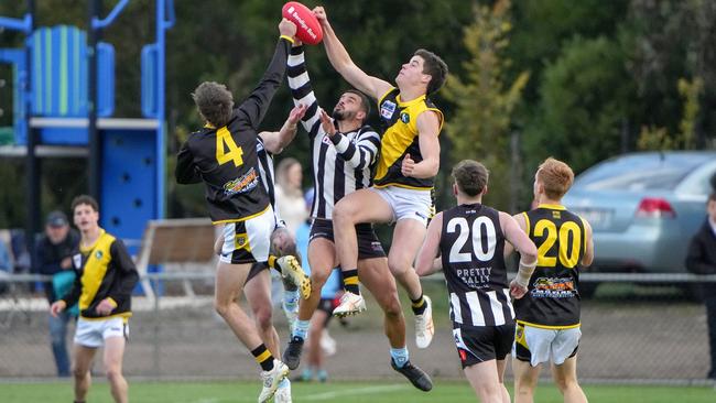 Wallan and Riddell players fly for the footy. Picture: George Sal