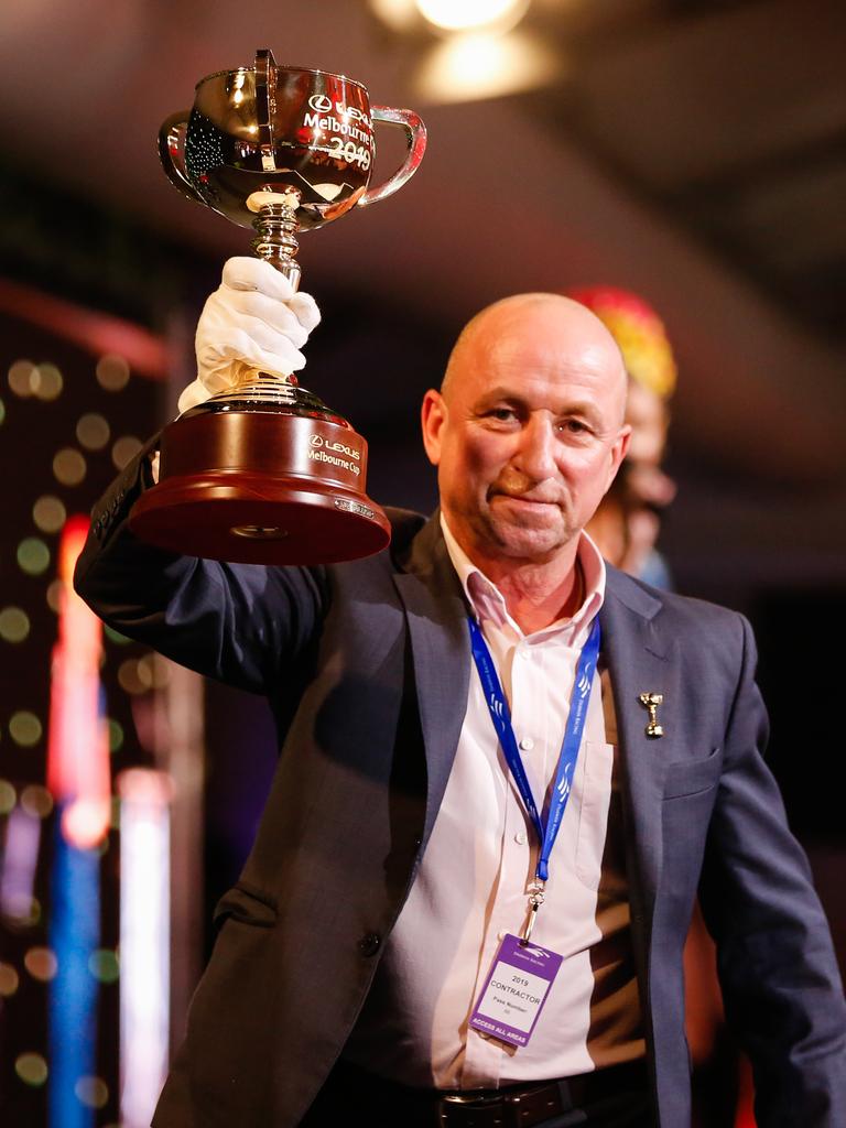 Melbourne Cup winning jockey Jimmy ‘Pumper’ Cassidy with the iconic Cup at the Bridge Toyota Ladies Day. Picture: GLENN CAMPBELL