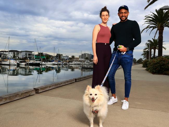 Grace and Sanath Hettiarachchi (with Millie) made the move from Moggill to Hope Island as working from home allows them the choice of a more relaxing lifestyle. Picture: Adam Head