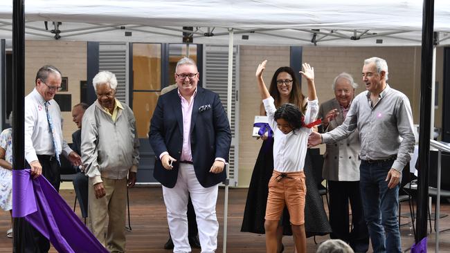 Hands in the air as Lennox Monaghan helps NSW minister for arts Don Harwin perfrom the official opening of the redevelopment of the Grafton Rregional Gallery .