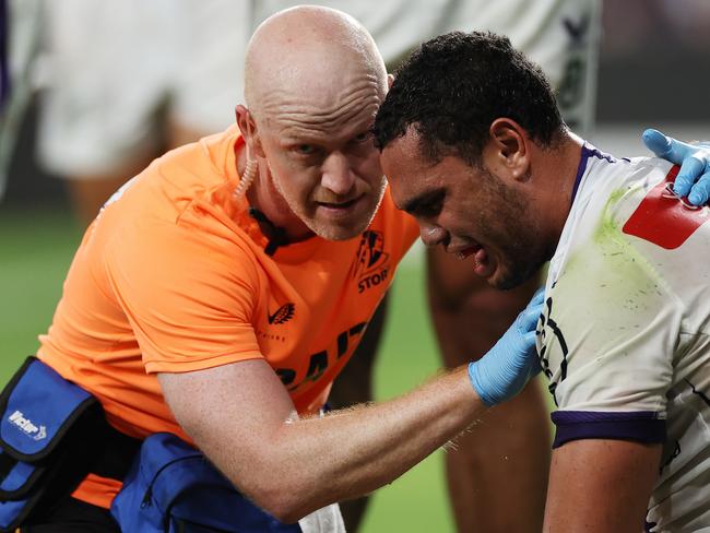 SYDNEY, AUSTRALIA - MARCH 02: Xavier Coates of the Storm receives treatment for an injury during the round one NRL match between the Parramatta Eels and the Melbourne Storm at CommBank Stadium on March 02, 2023 in Sydney, Australia. (Photo by Cameron Spencer/Getty Images)