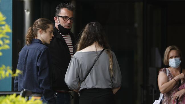 Theo Hayez' father Laurent Hayez talks with other family members at Byron Bay Court House on Monday. Picture: Liana Boss