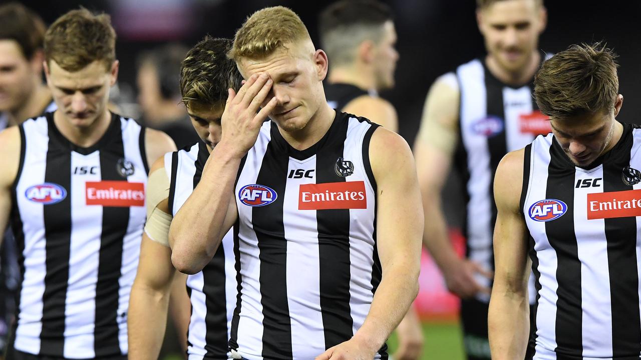Adam Treloar of the Magpies reacts to their shock loss.