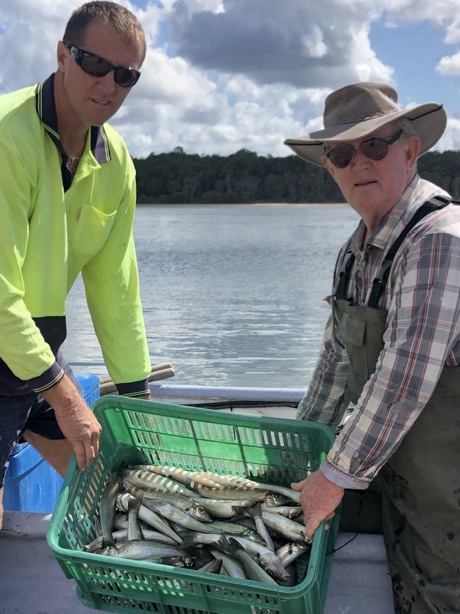 Commercial fisherman in Tin Can Bay Mark Alexander and Joe McLeod (right). Photo: Contributed.