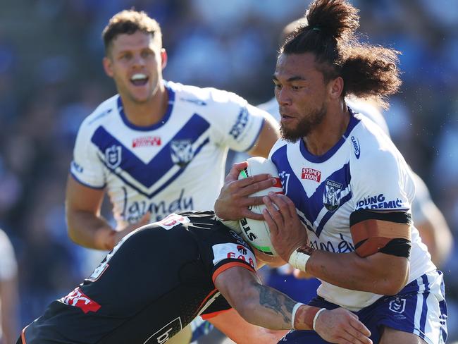 Raymond Fatal-Mariner of the Bulldogs is tackled during the round three NRL match between Canterbury Bulldogs and Wests Tigers at Sydney’s Belmore. With temperatures in the high 30s, heat-safe measures were implemented for player safety. Picture: Mark Metcalfe/Getty Images