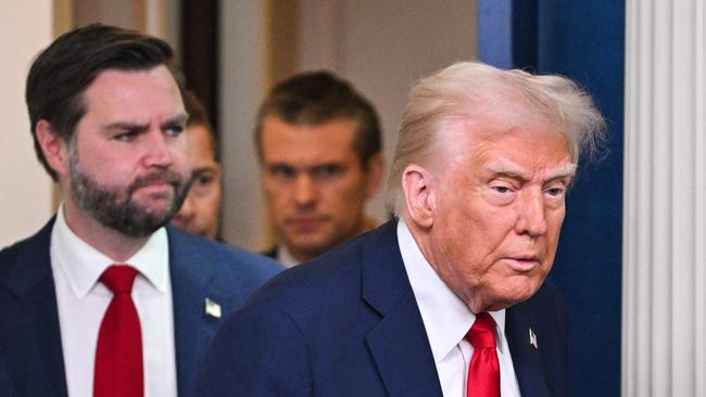 US President Donald Trump (R), trailed by Secretary of Defense Pete Hegseth (C) and Vice President JD Vance (L), arrives to speak about the mid-air crash between American Airlines flight 5342 and a military helicopter in Washington, in the Brady Press Briefing Room at the White House on January 30, 2025 in Washington, DC. Divers pulled bodies from the icy waters of Washington's Potomac river Thursday after a US military helicopter collided midair with a passenger plane carrying 64 people, with officials saying there were likely no survivors. (Photo by ROBERTO SCHMIDT / AFP)