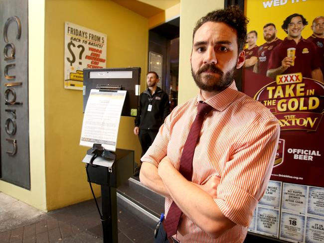 Alex Farquhar, General Manager at The Caxton Hotel, with the QikID ID Scanner. Picture: Image AAP/Steve Pohlner