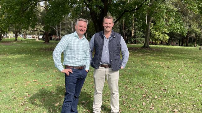 Energy Minister Chris Bowen pictured on April 29, 2022, promising a community battery for Narara in the marginal NSW seat of Robertson while he was in opposition. Dr Gorden Reid (right) won the seat off the Liberal Party at the election.