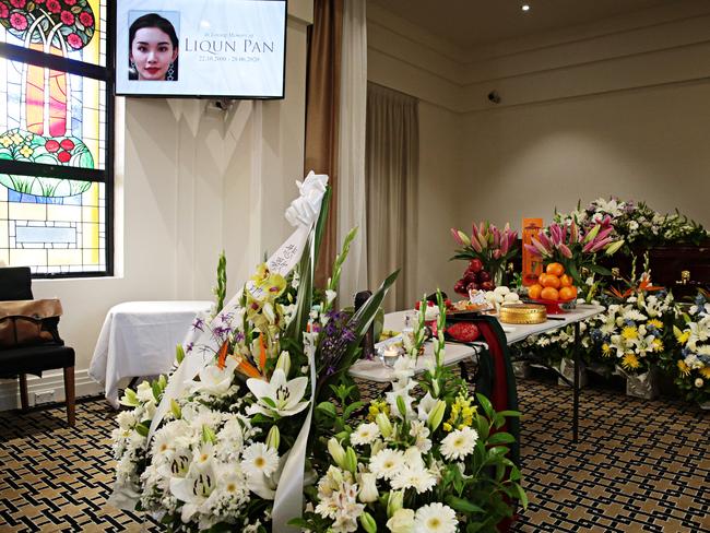 Ms Pan’s coffin surrounded by flowers on Tuesday. PICTURE: Adam Yip