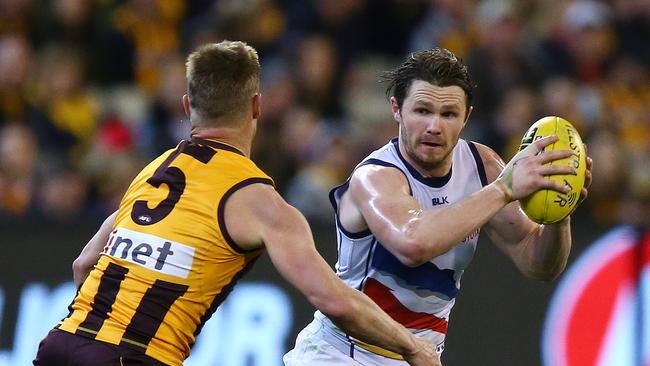 Adelaide’s Patrick Dangerfield dodges Sam Mitchell. Picture: Sarah Reed