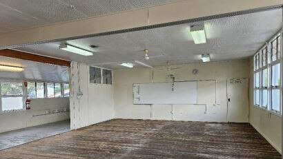 Two school blocks at Rochedale State School were cleared after asbestos containing dust was found in the ceiling tiles.