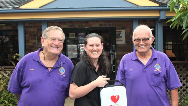 Orara Valley Lions Club president Gary Elston, Golden Dog Hotel owner Stephanie Luck and club secretary Noel Backman with a donated defibrillator. Photo: Tim Jarrett