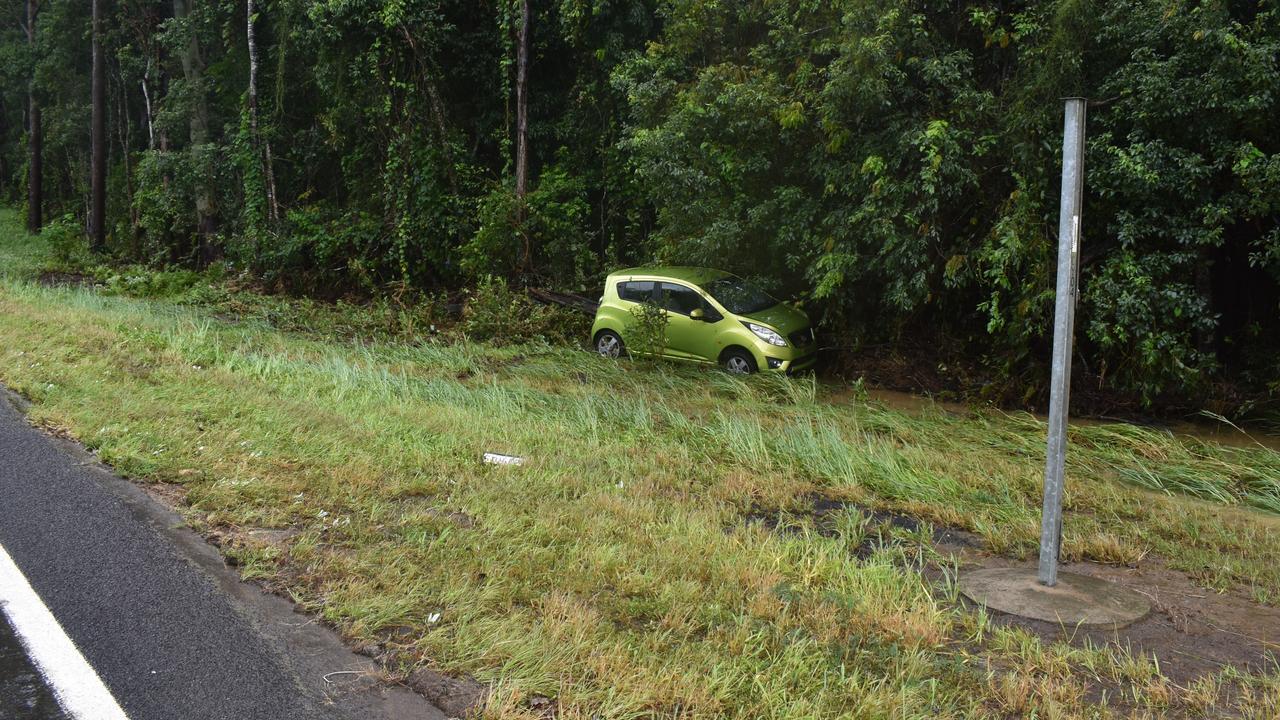 A car washed up against trees due to the heavy rainfall and flooding in Cooroy overnight. Picture: Eddie Franklin