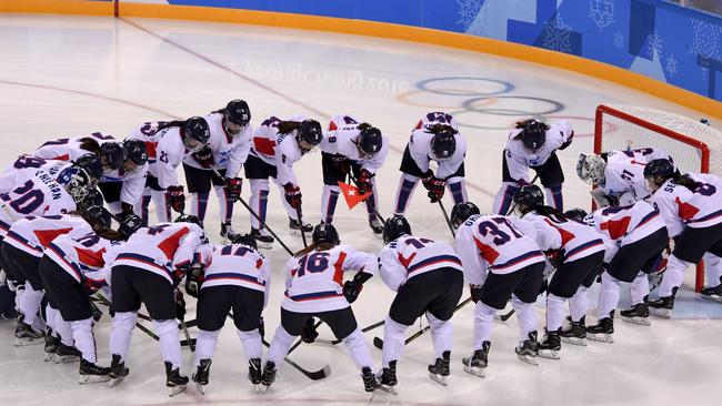 The unified Korean team gathers in a group before the women's preliminary round ice hockey match between Switzerland and the Unified Korean team during the Pyeongchang 2018 Winter Olympic. Picture: AFP