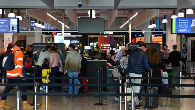 Teams of highly-visible Australian Federal Police officers will be deployed to bolster security at Melbourne Airport, along with additional bomb-detector dogs. Picture: AAP