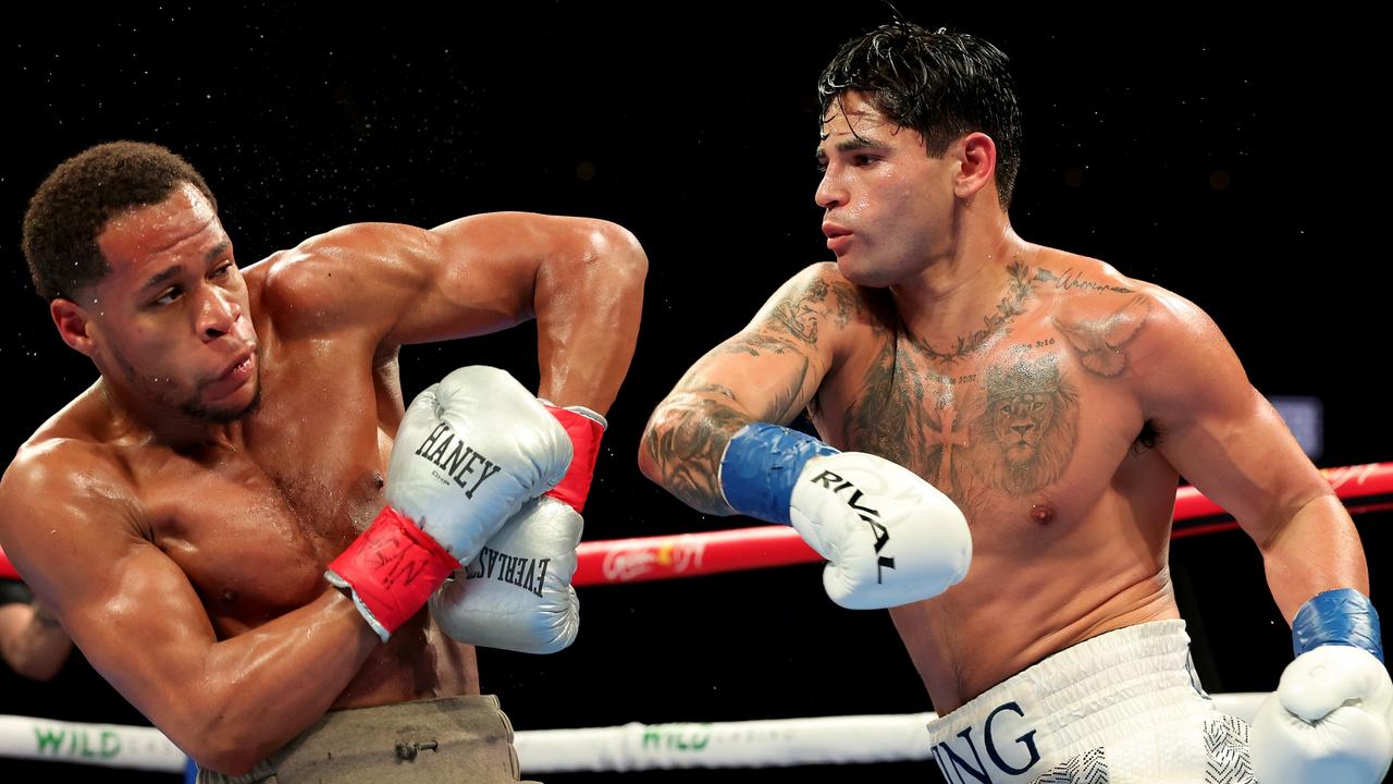 NEW YORK, NEW YORK - APRIL 20: Ryan Garcia (white trunks) punches Devin Haney (gray trunks) during their WBC Super Lightweight title bout at Barclays Center on April 20, 2024 in New York City. (Photo by Al Bello/Getty Images)