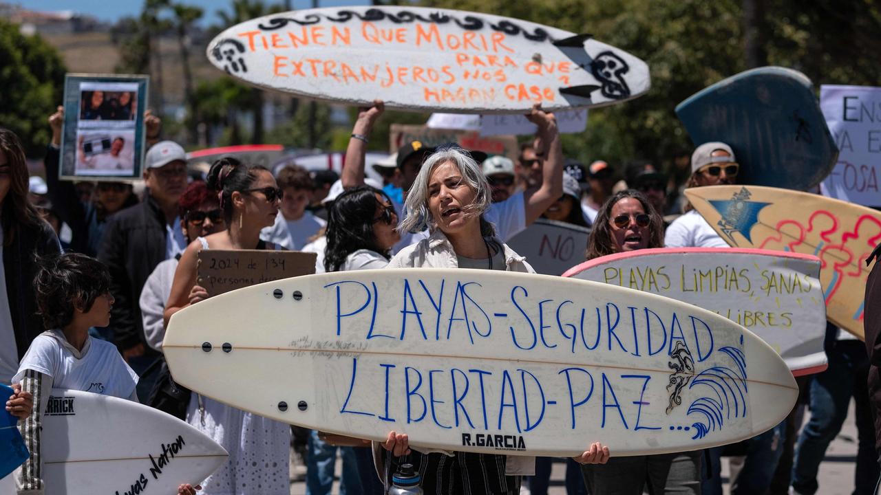 Members of the surfing community in Ensenada, Baja California protest for safety. Picture: Guillermo Arias / AFP