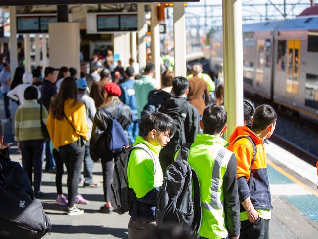 Commuters wait at Redfern station due to technical issues. Picture: Luke Drew