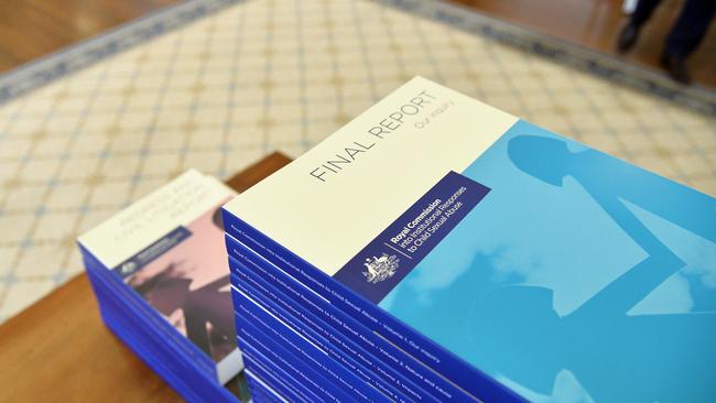 The volumes of the final Report of the Royal Commission into Institutional Responses to Child Sexual Abuse at Government House, Canberra. Picture: Jeremy Piper