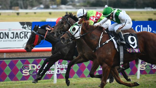 In a photo finish, jockey Rachel King steered home the Brett Partelle trained Trust Me to victory in the Sir James Kirby Handicap (1000 metres).