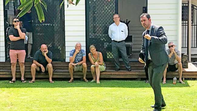 James Bell calls the bidding at 111 Parker St in Maroochydore on Saturday. Picture: Sally Waghorn