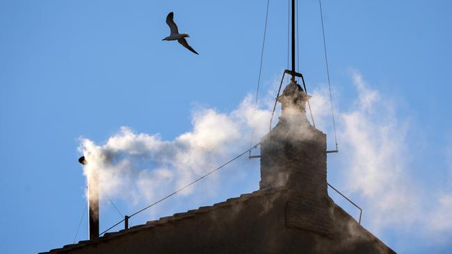 White smoke rises from the chimney on the roof of the Sistine Chapel indicating that the College of Cardinals have elected a new Pope on May 8 in Vatican City. Picture: Getty