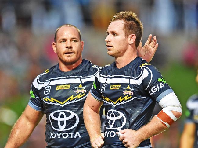 Round 3 match of the NRL Telstra Premiership between the North Queensland Cowboys v Cronulla Sharks from 1300 Smiles Stadium, Towsnville.   Cowboys Matt Scott consoles team mate Michael Morgan after a Sharks try. Picture: Zak Simmonds