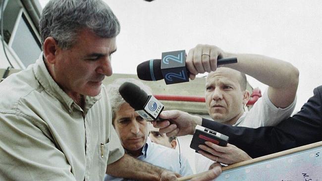 2001: Gabi Ofir, head of the Israel Airports Authority, shows journalists a map showing the flightpath of downed Sibir Airlines flight 1812. Picture: AP