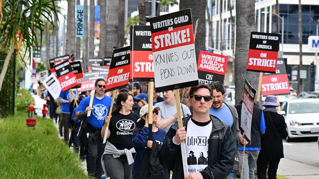 A strike by the Writers Guild of America, which broke out over partly over the refusal of studios like Netflix and Disney to rule out artificial intelligence replacing human scribes. Picture: AFP