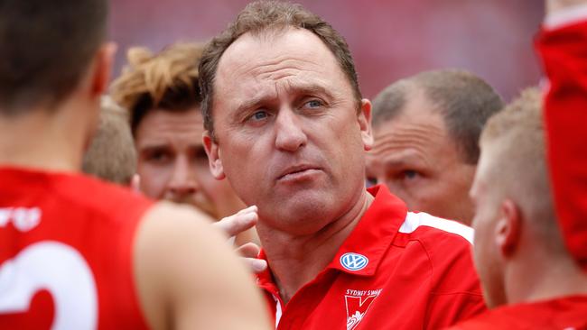 Sydney coach John Longmire talks to his players.