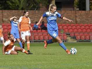 ON THE CHARGE: South West Queensland Thunder captain Melanie Lloyd takes on the Brisbane Roar defence earlier this season. The Thunder play Gold Coast tomorrow. Picture: Bev Lacey