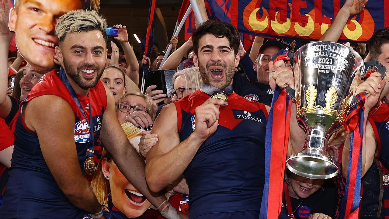 Christian Petracca shows off his premiership medal, with his Norm Smith tucked under his jumper. Picture: Michael Klein