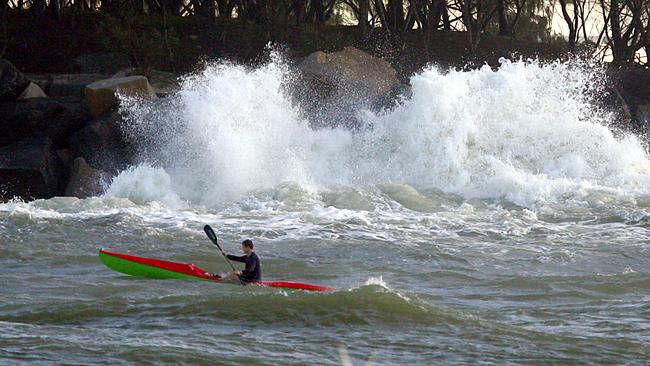 A man in a kayak in strong seas in the Seaway.