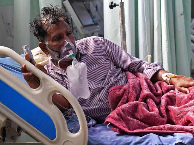 A COVID-19 patient breathes with the help of an oxygen mask inside the Intensive Care Unit of the Teerthanker Mahaveer University hospital in Moradabad. Picture: AFP