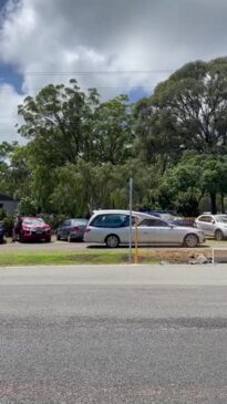 Scott Cabrie's coffin leaves Toogoom Community Hall at the funeral service