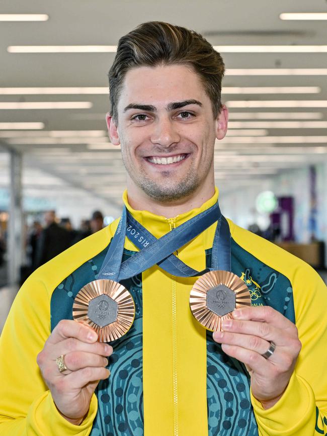 South Australian Olympic cyclist Matthew Glaetzer arrives home with his two bronze medals at Adelaide airport. Picture: NewsWire / Brenton Edwards