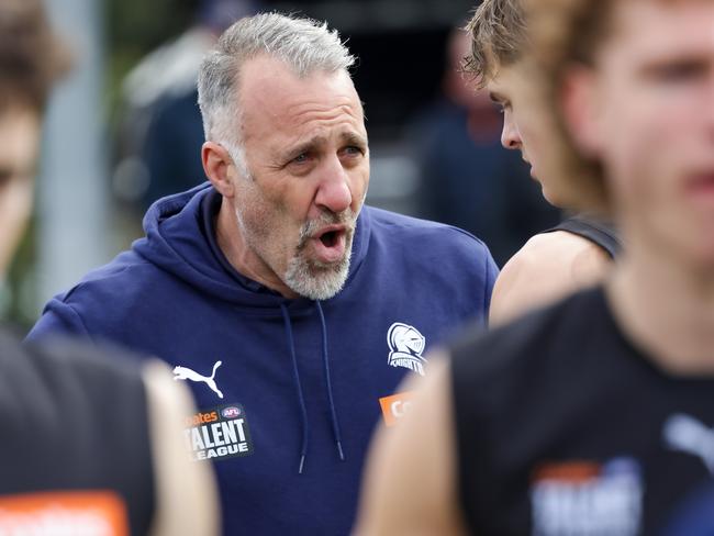 Former AFL Collingwood player Anthony Rocca who is a mentor at the Northern Knights FC, gives some advice at 3 quarter time in their game against the Sandringham Dragons. Picture: Ian Currie