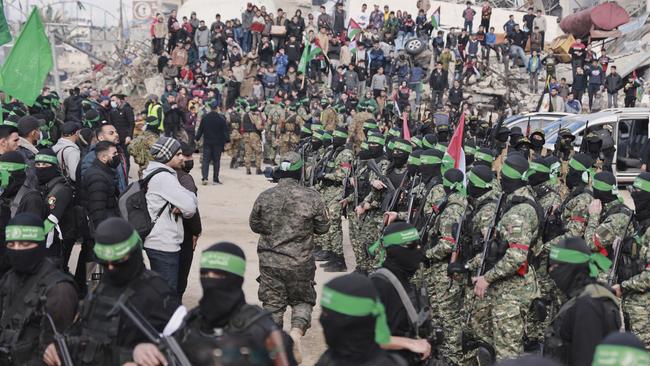 Hamas and Islamic Jihad fighters are deployed in central Gaza City before the release of four Israeli female hostages. Picture: AP