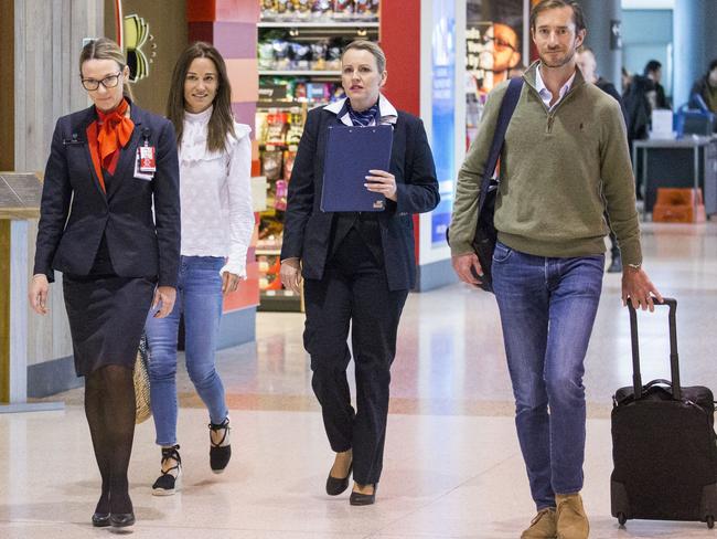 When you’re near-royalty you get your own special clipboard-wielding airport helper. Picture: Media Mode