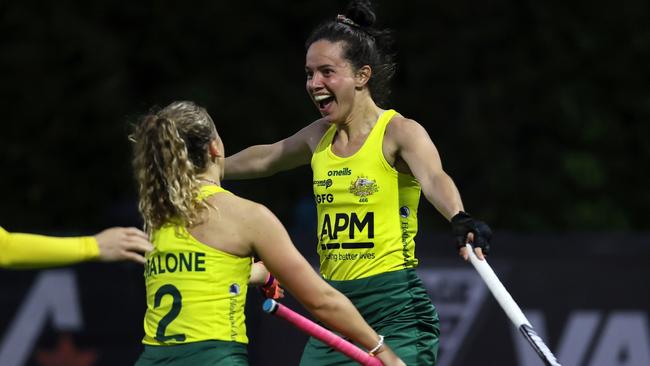 Hockeyroo star Brooke Peris embraces Rose Malone.